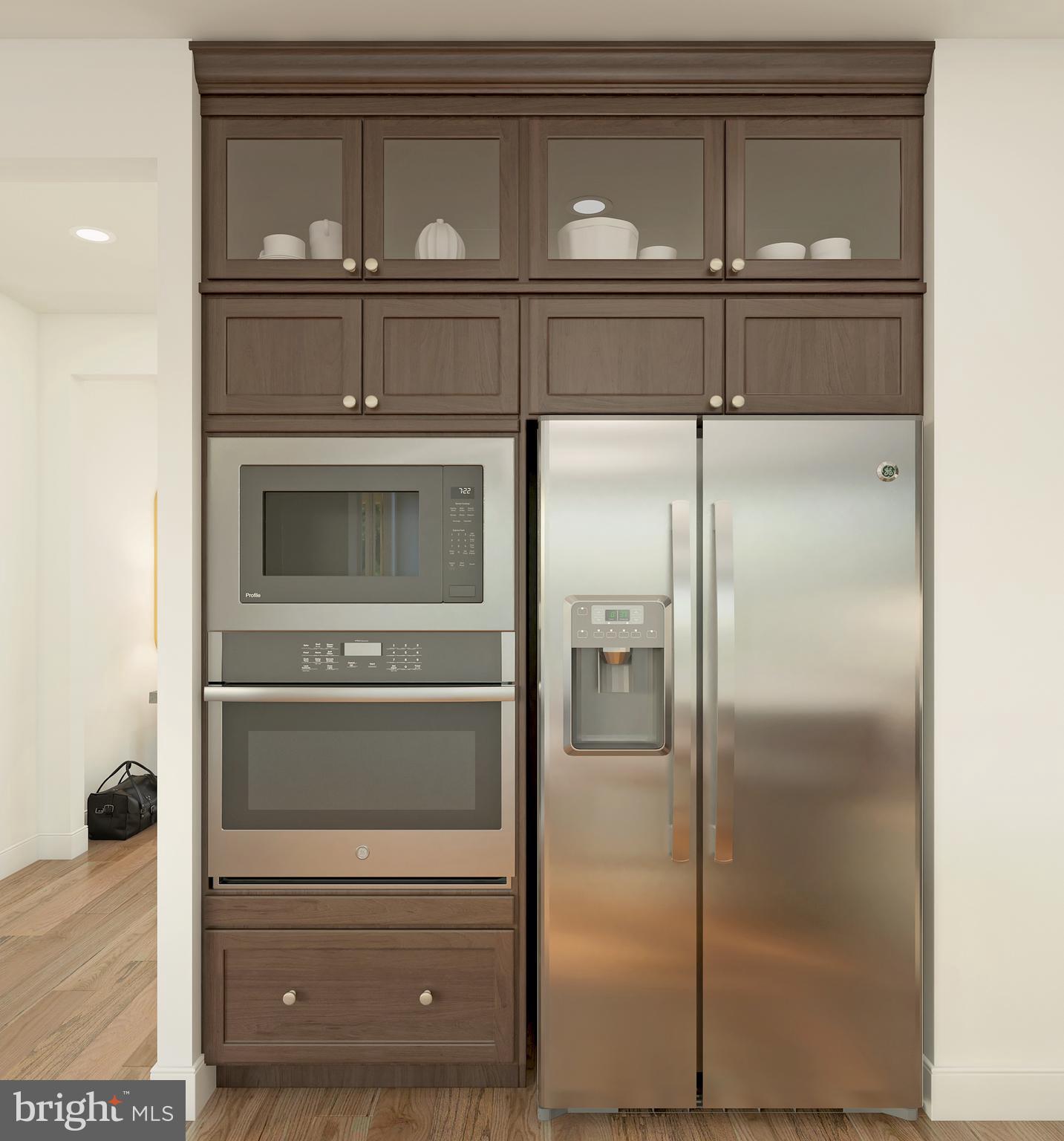 843 Merlin Drive Middletown, DE 19709 - Photo 9 of 16 a kitchen with a refrigerator and a wooden floor