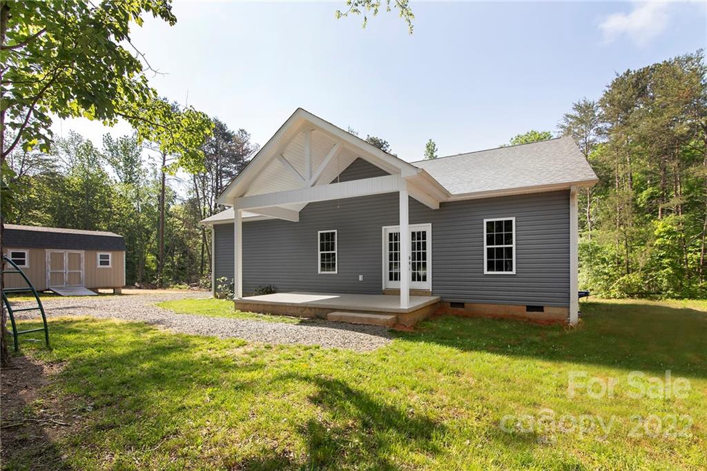 345 Lm Overcash Road Salisbury, NC 28146 - Photo 1 of 23 a house that has a big yard large trees with wooden fence