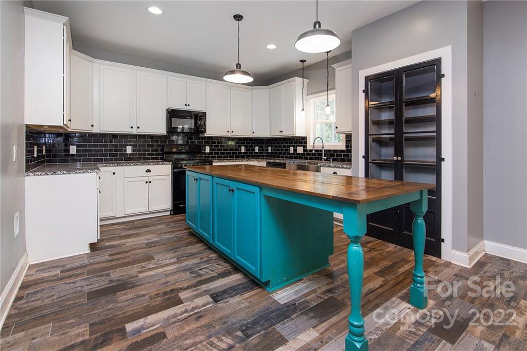 345 Lm Overcash Road Salisbury, NC 28146 - Photo 11 of 23 a large kitchen with kitchen island granite countertop a sink stainless steel appliances and cabinets