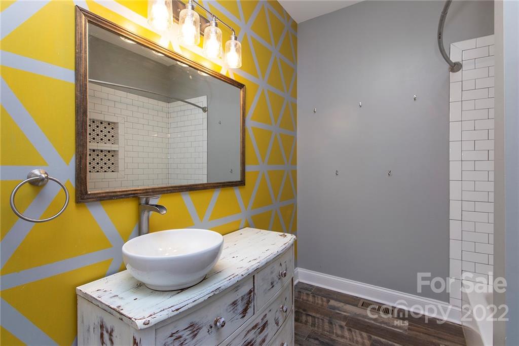 345 Lm Overcash Road Salisbury, NC 28146 - Photo 16 of 23 a bathroom with a granite countertop sink and a mirror