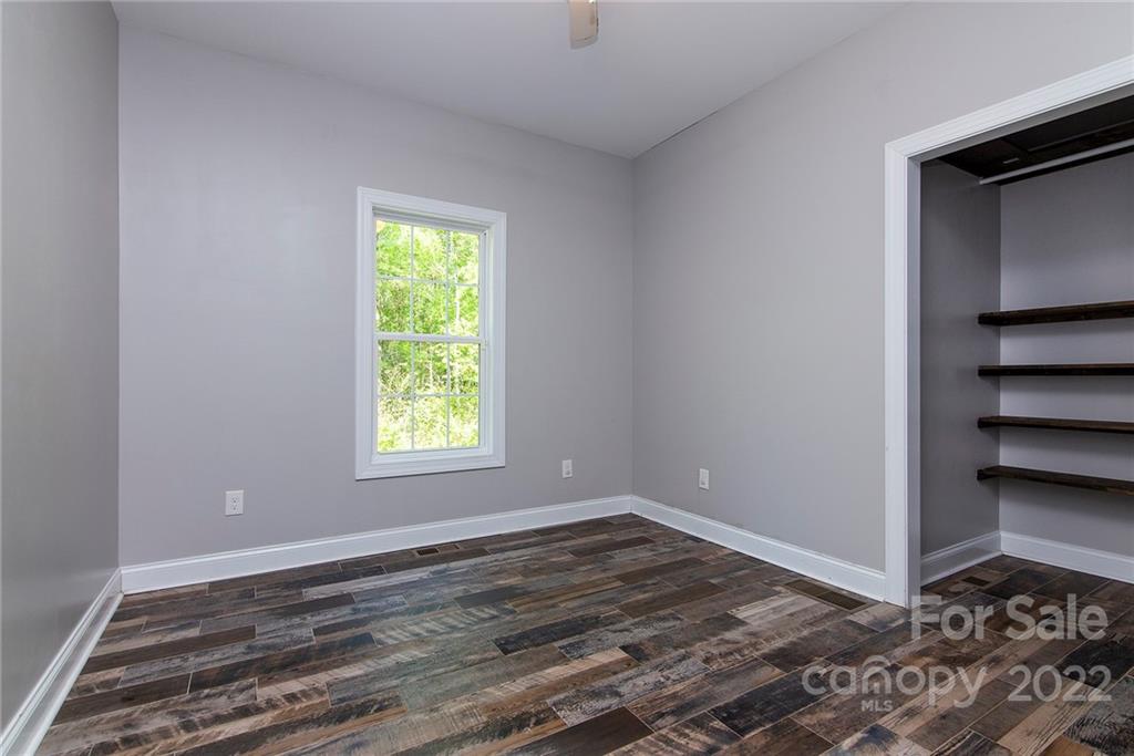 345 Lm Overcash Road Salisbury, NC 28146 - Photo 20 of 23 a view of room with window and hardwood floor
