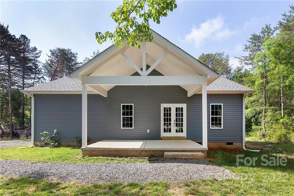 345 Lm Overcash Road Salisbury, NC 28146 - Photo 2 of 23 a house that has a lot of plants and trees in the background