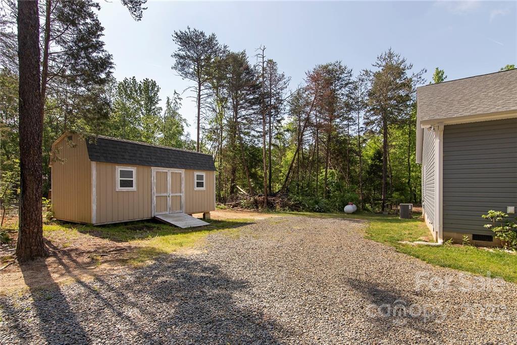 345 Lm Overcash Road Salisbury, NC 28146 - Photo 21 of 23 a view of a house with a yard covered in snow