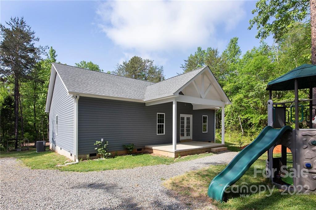 345 Lm Overcash Road Salisbury, NC 28146 - Photo 3 of 23 a front view of a house with a yard and potted plants