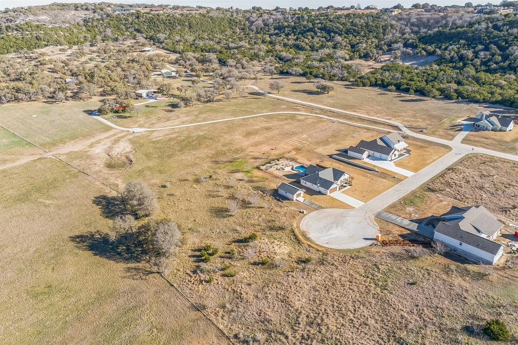 104 Round Up Circle Burnet, TX 78611 - Photo 13 of 17 an aerial view of a house with a yard