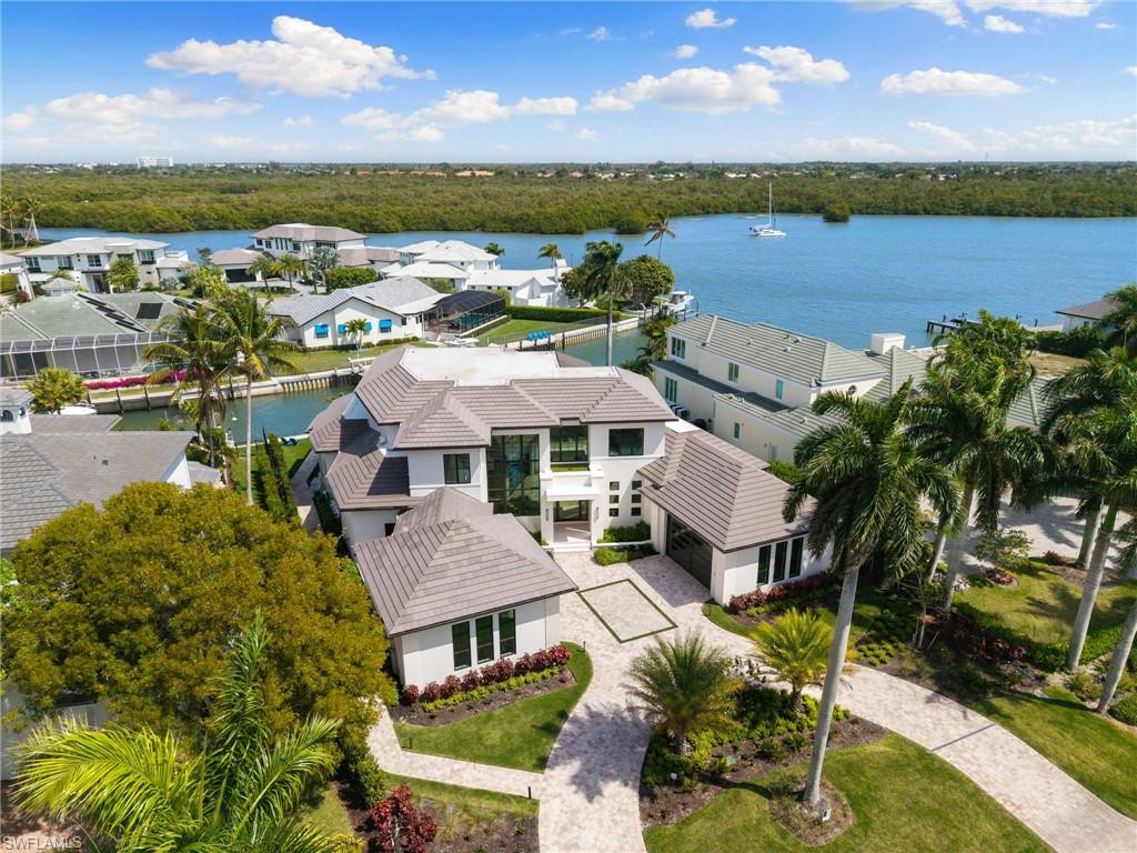2345 Tarpon Road Naples, FL 34102 - Photo 37 of 43 Aerial perspective of suburban area featuring a large body of water