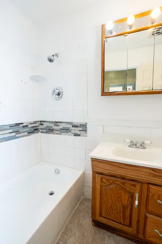 a bathroom with a sink and a bathtub