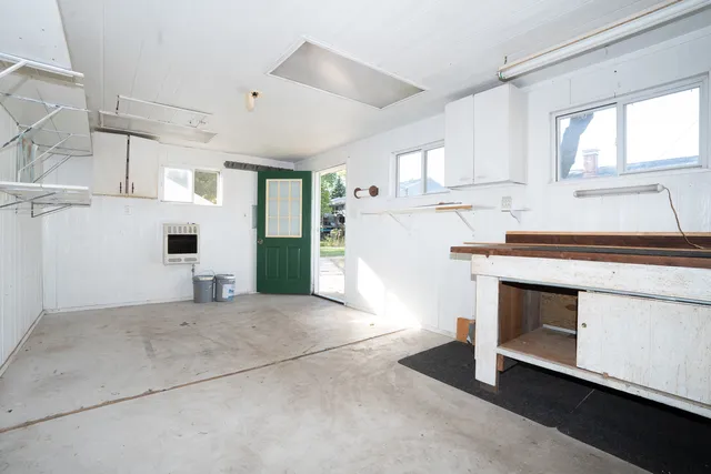 a view of a wooden deck with a yard