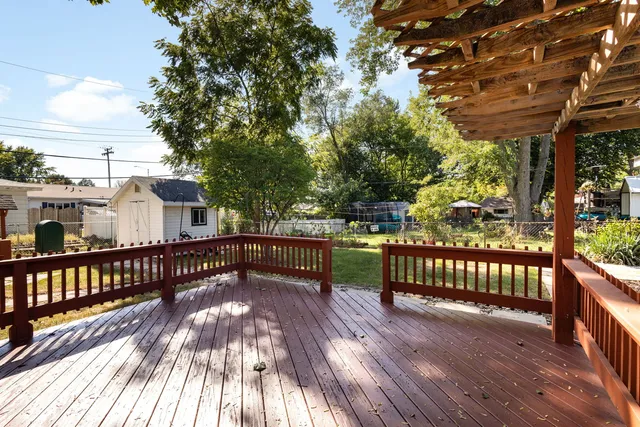 a view of a house with wooden deck
