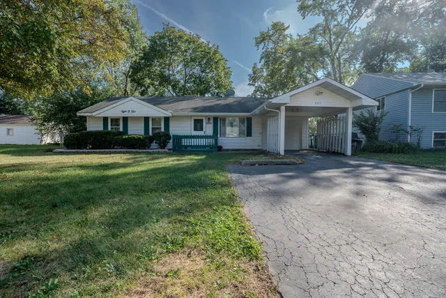 a view of a house with swimming pool and sitting area