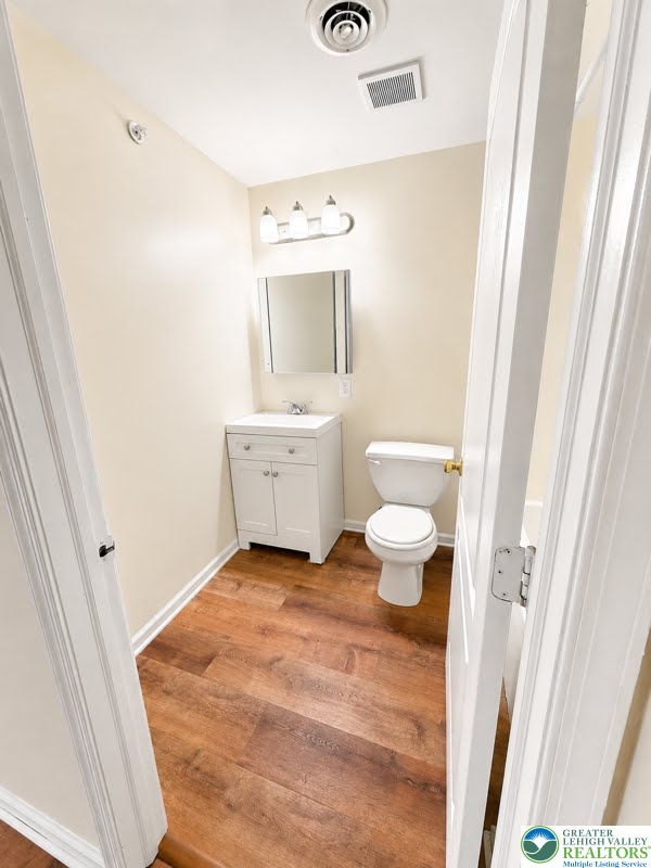 3496 Linden Street, Unit UPPR Bethlehem, PA 18017 - Photo 7 of 9 Functional full bathroom featuring a vanity with storage and durable wood flooring.