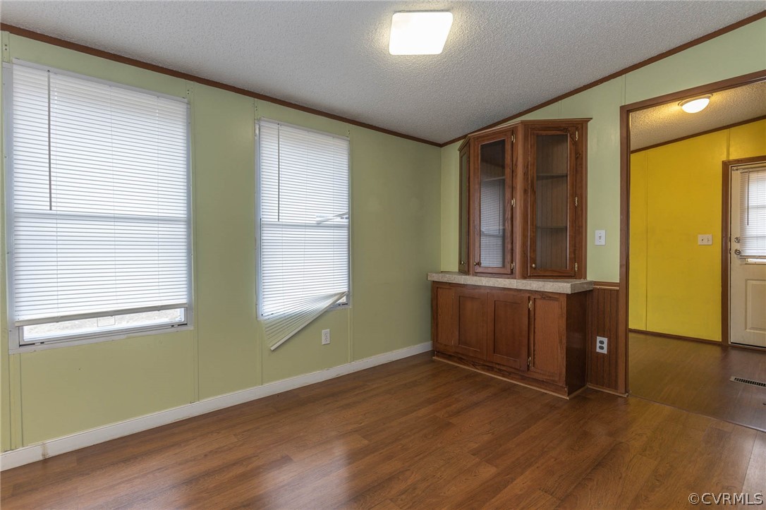 6400 Hair Road Disputanta, VA 23842 - Photo 11 of 30 a view of a room with wooden floor and a window