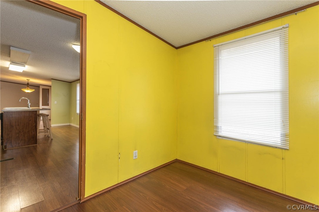 6400 Hair Road Disputanta, VA 23842 - Photo 13 of 30 a view of a big room with wooden floor and windows