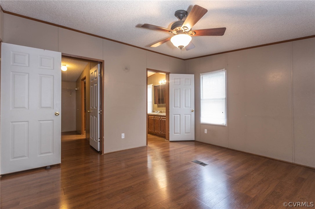 6400 Hair Road Disputanta, VA 23842 - Photo 14 of 30 an empty room with wooden floor and windows
