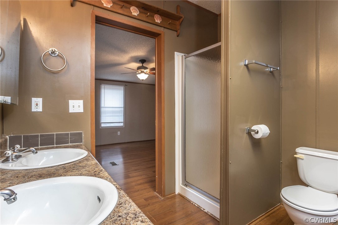 6400 Hair Road Disputanta, VA 23842 - Photo 18 of 30 a bathroom with a granite countertop sink toilet and shower