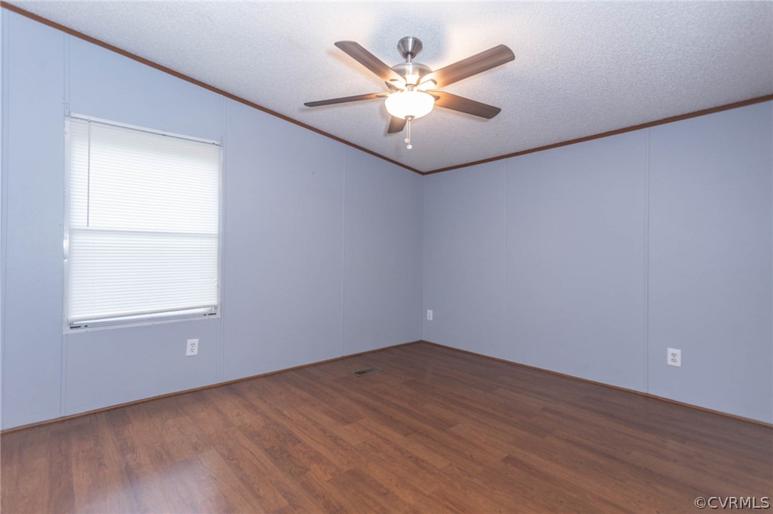 6400 Hair Road Disputanta, VA 23842 - Photo 22 of 30 an empty room with wooden floor and windows