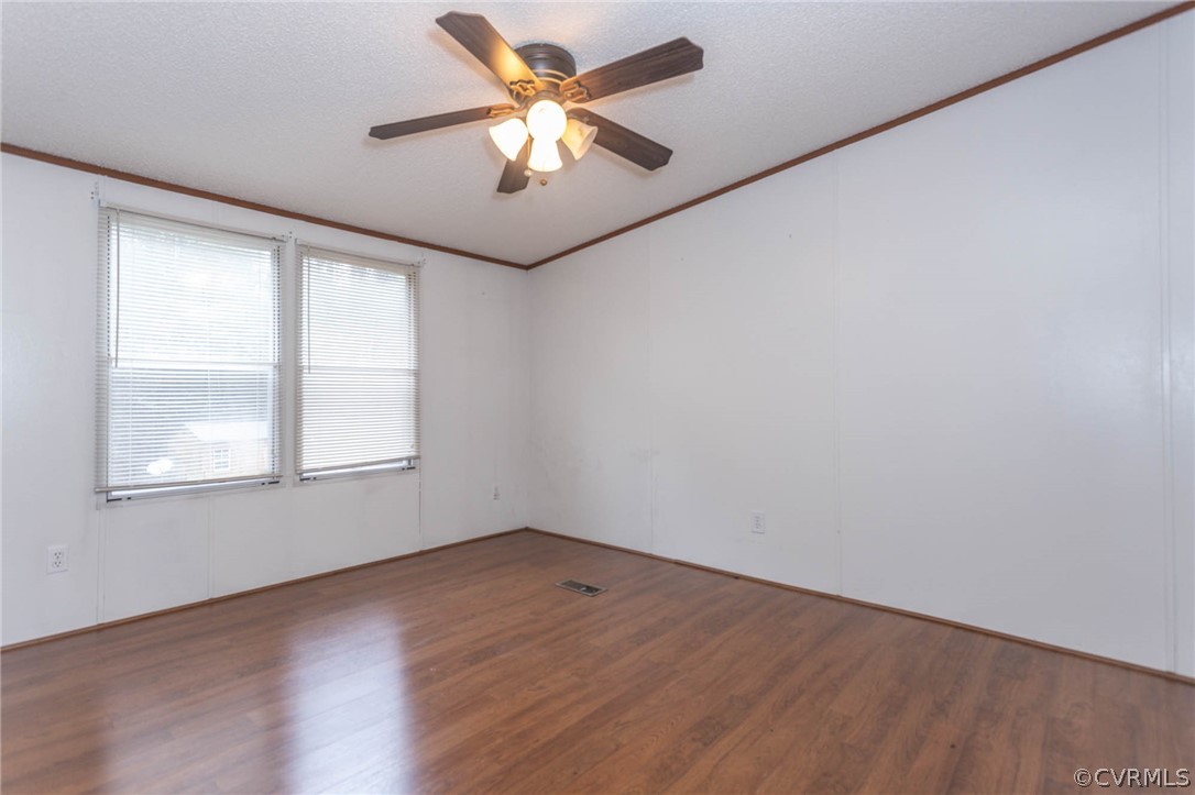 6400 Hair Road Disputanta, VA 23842 - Photo 26 of 30 an empty room with a window and a fan