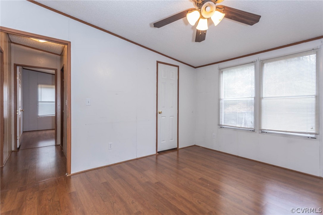 6400 Hair Road Disputanta, VA 23842 - Photo 27 of 30 a view of an empty room with wooden floor and a window