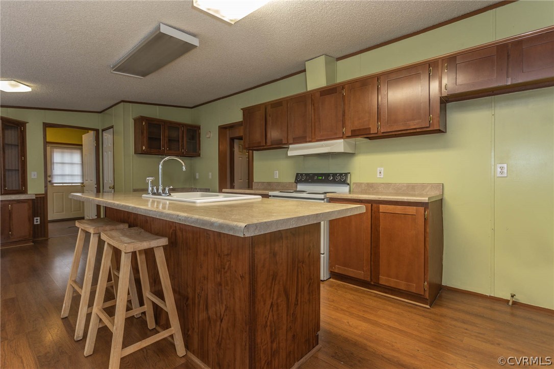 6400 Hair Road Disputanta, VA 23842 - Photo 8 of 30 a kitchen with kitchen island granite countertop a sink stainless steel appliances wooden floor and cabinets