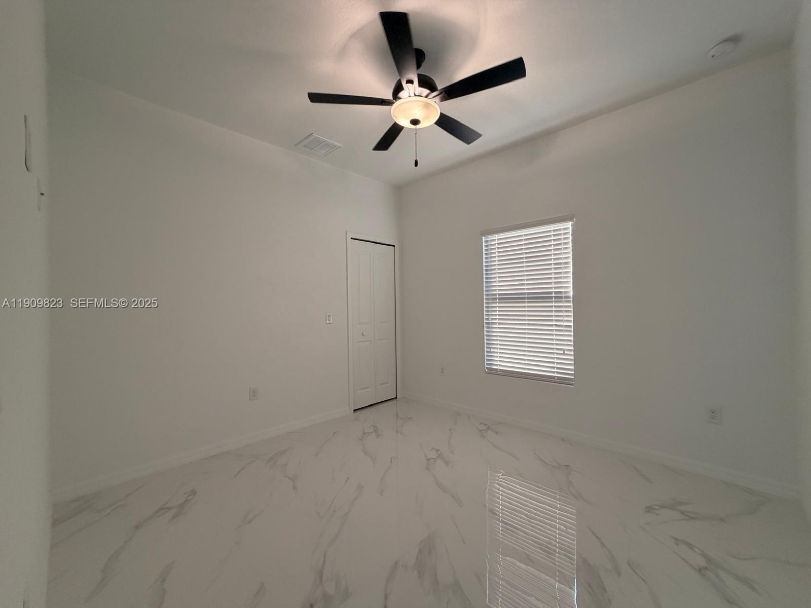 2706 72nd Street West Lehigh Acres, FL 33971 - Photo 13 of 21 a view of an empty room with a window