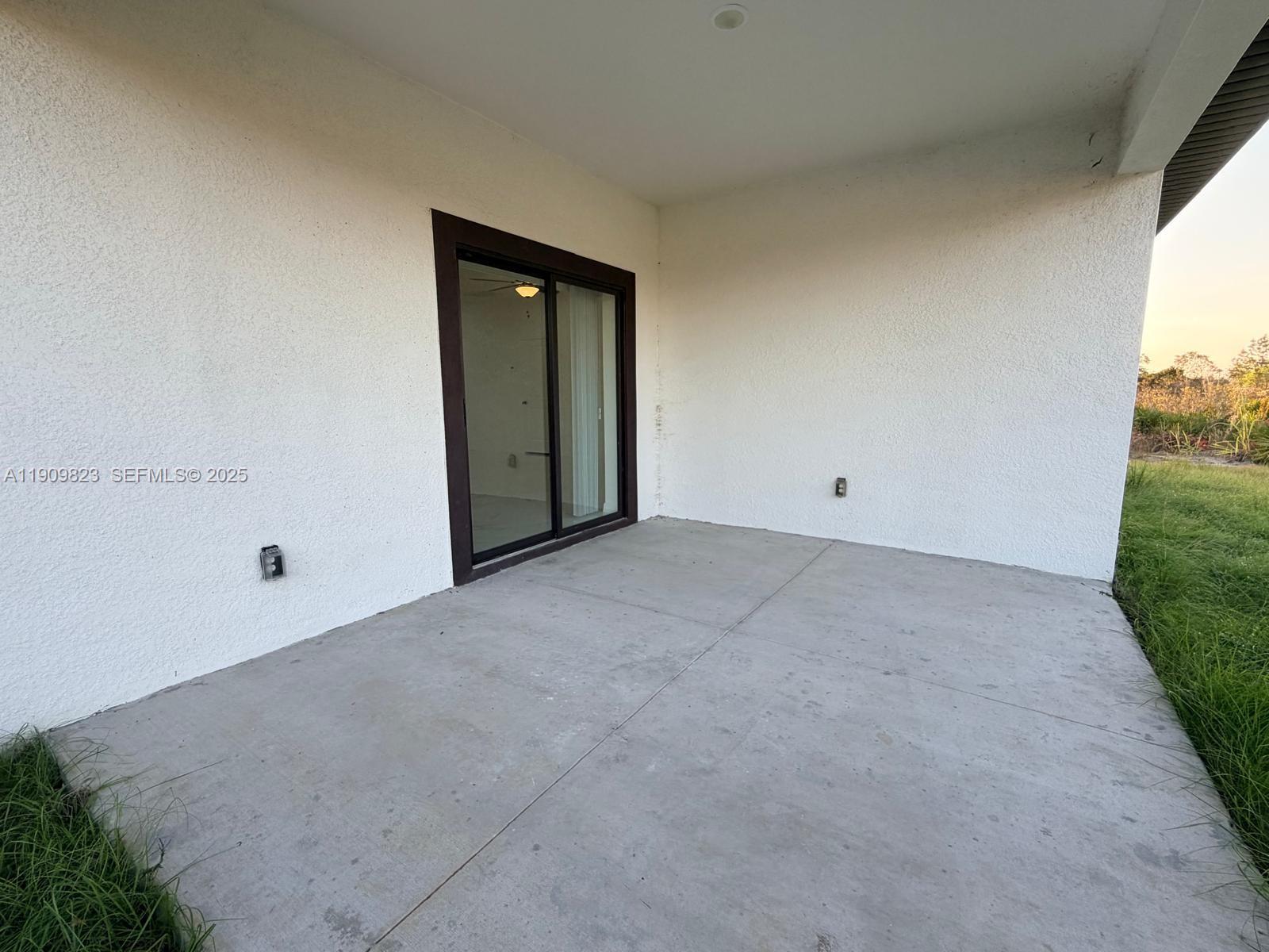 2706 72nd Street West Lehigh Acres, FL 33971 - Photo 16 of 21 a view of an empty room with a window