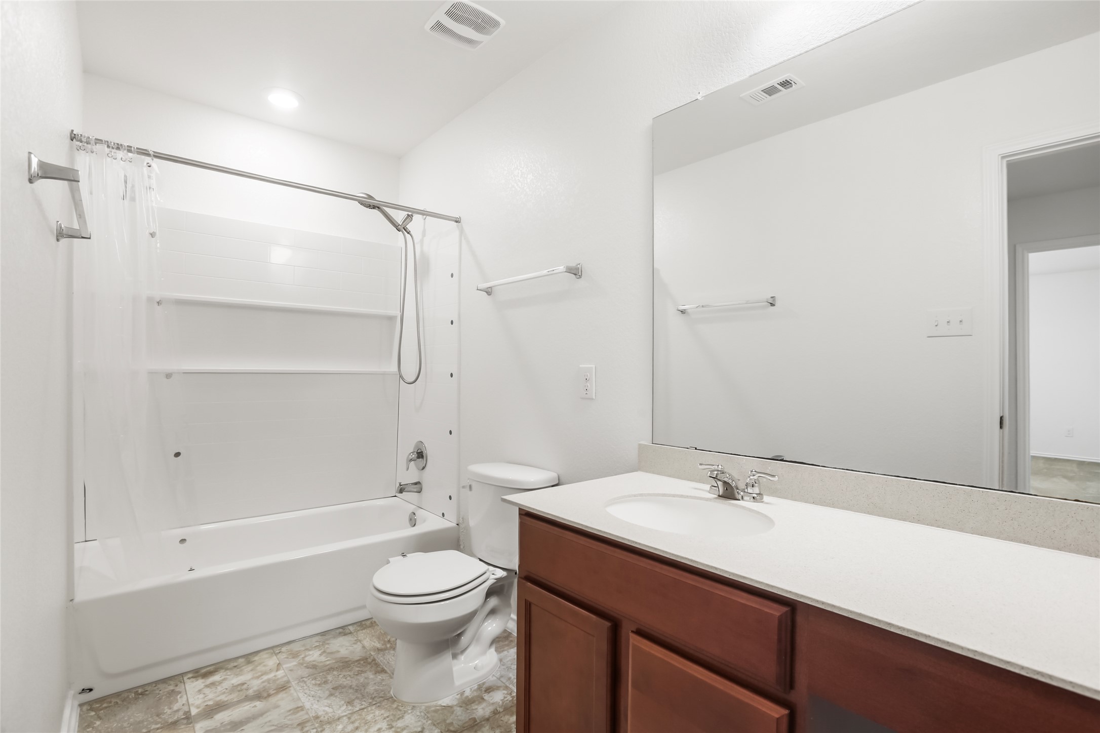 18917 Rushmore Street Manor, TX 78653 - Photo 19 of 28 a bathroom with a sink a toilet and shower