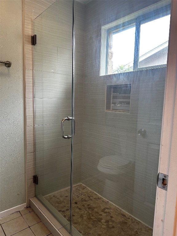 504 Suzzane Road Pflugerville, TX 78660 - Photo 11 of 15 a bathroom with a shower