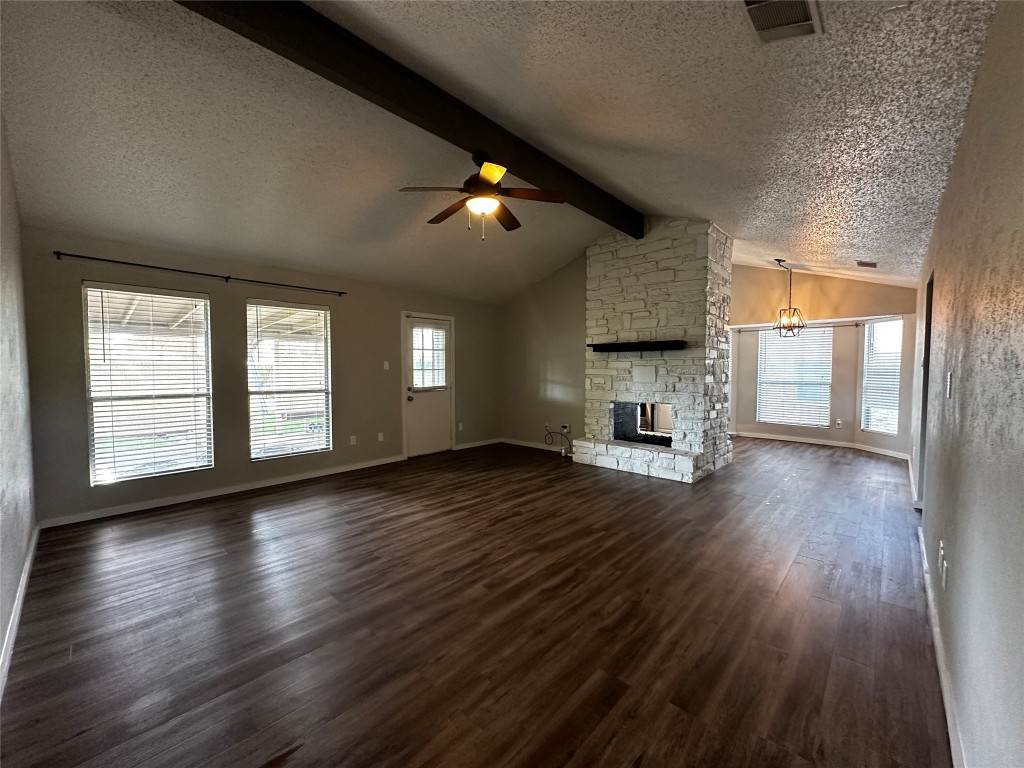 504 Suzzane Road Pflugerville, TX 78660 - Photo 2 of 15 a view of empty room with wooden floor and fan