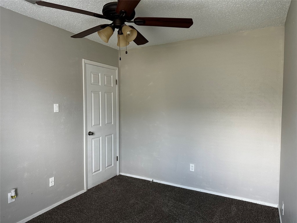 504 Suzzane Road Pflugerville, TX 78660 - Photo 6 of 15 a view of room with a ceiling fan