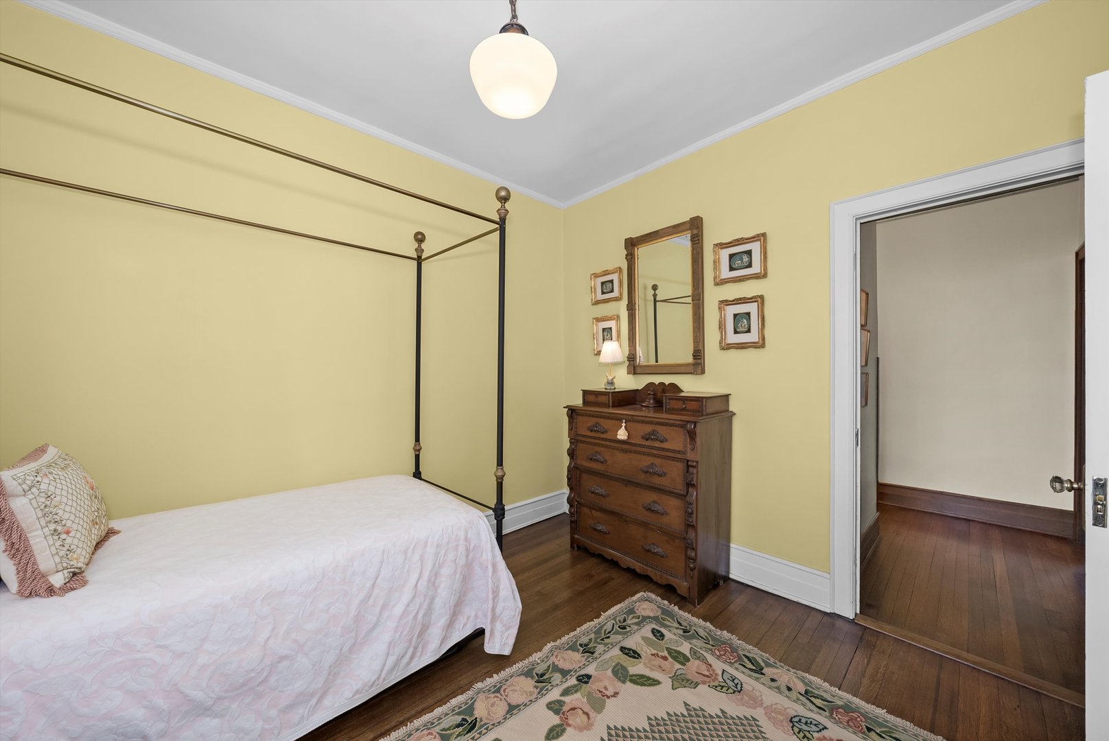 666 West Irving Park Road, Unit I4 Chicago, IL 60613 - Photo 24 of 27 a bedroom with a bed and wooden floor