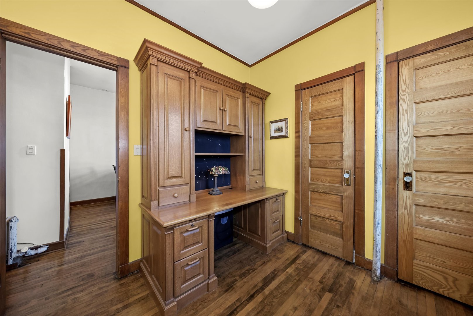 666 West Irving Park Road, Unit I4 Chicago, IL 60613 - Photo 25 of 27 a room with furniture and a wooden floor