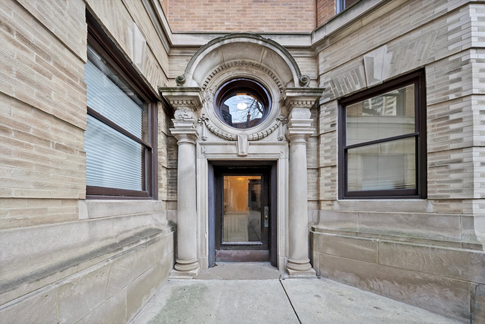666 West Irving Park Road, Unit I4 Chicago, IL 60613 - Photo 3 of 27 a view of a house with a large door and a window
