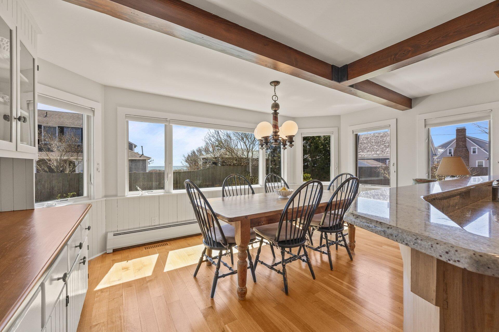8 Wyndemere Bluffs Road Harwich Port, MA 02646 - Photo 11 of 37 a view of a dining room with furniture window and wooden floor