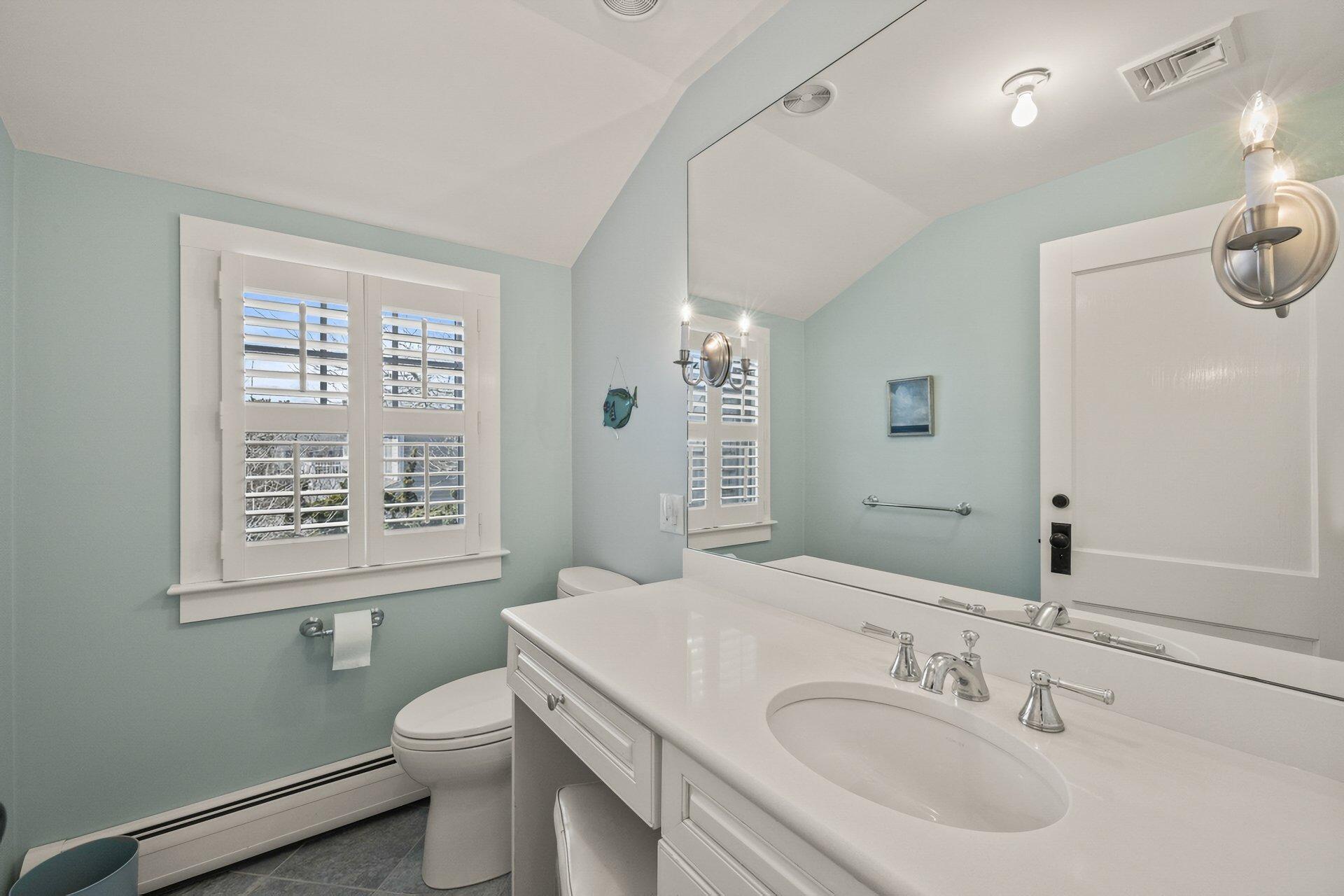 8 Wyndemere Bluffs Road Harwich Port, MA 02646 - Photo 19 of 37 a bathroom with a sink a toilet and a mirror