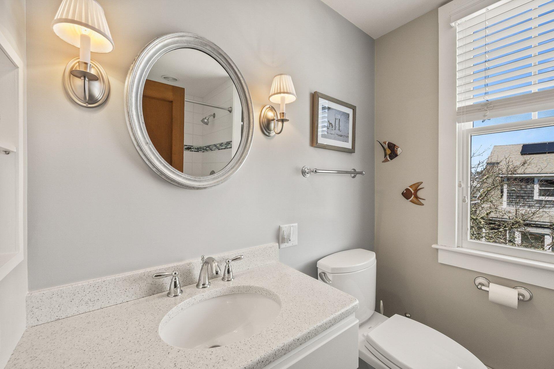 8 Wyndemere Bluffs Road Harwich Port, MA 02646 - Photo 24 of 37 a bathroom with a toilet a sink and a mirror
