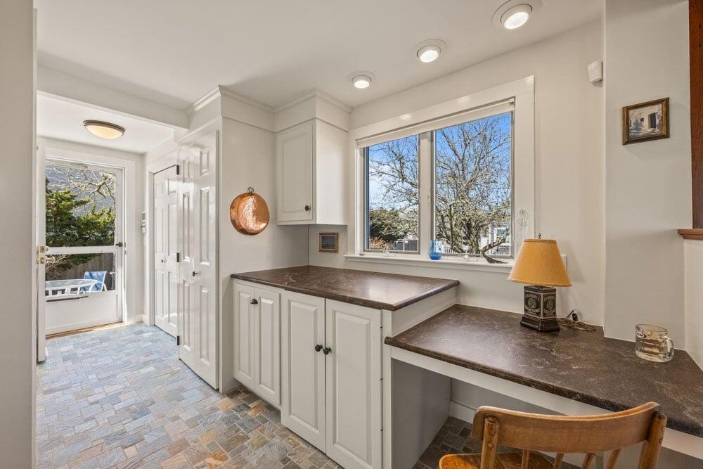 8 Wyndemere Bluffs Road Harwich Port, MA 02646 - Photo 29 of 37 a kitchen with a sink and a refrigerator
