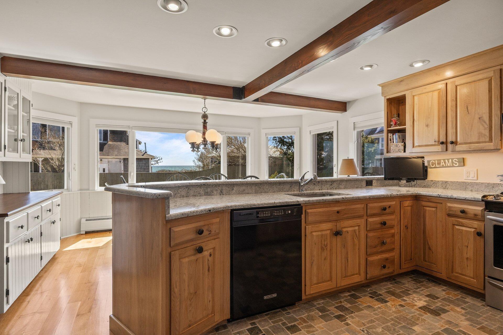 8 Wyndemere Bluffs Road Harwich Port, MA 02646 - Photo 10 of 37 a spacious bathroom with a granite countertop sink and a large mirror