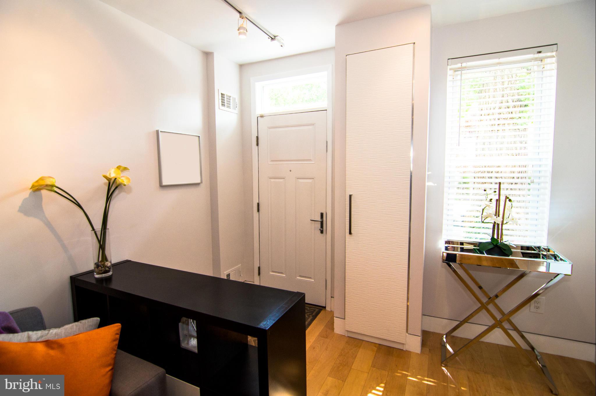 606 14th Place Northeast Washington, DC 20002 - Photo 2 of 28 a living room with furniture and a window