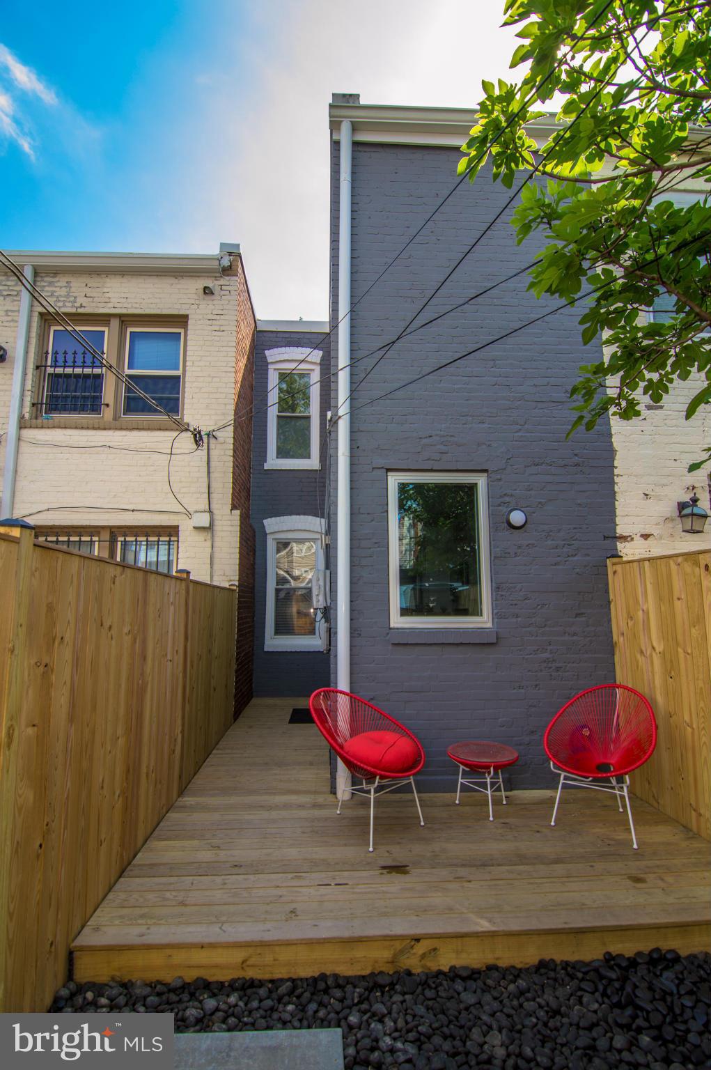 606 14th Place Northeast Washington, DC 20002 - Photo 14 of 28 a table and chair in front of a house