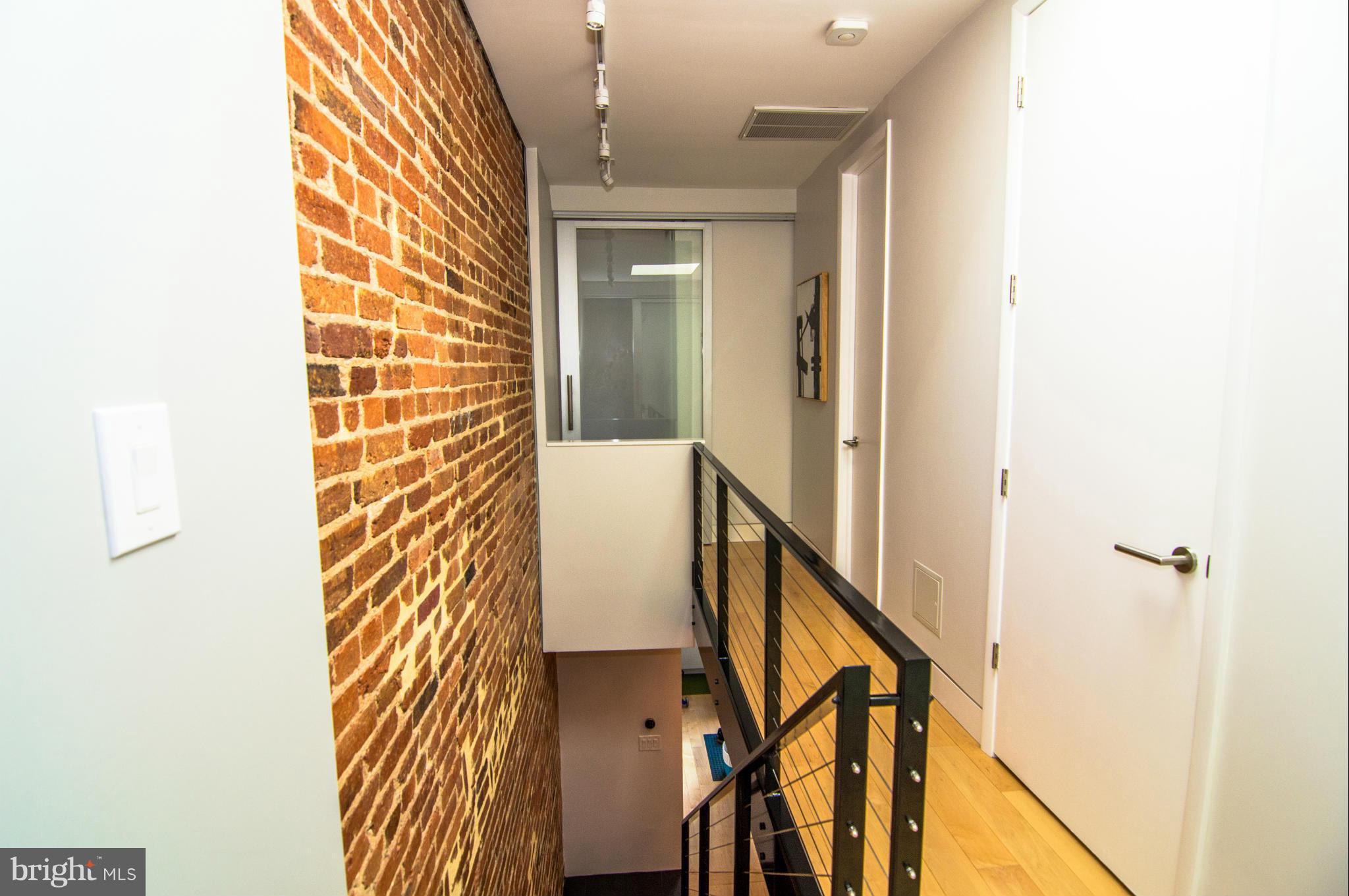 606 14th Place Northeast Washington, DC 20002 - Photo 21 of 28 a view of a hallway with wooden floor and staircase