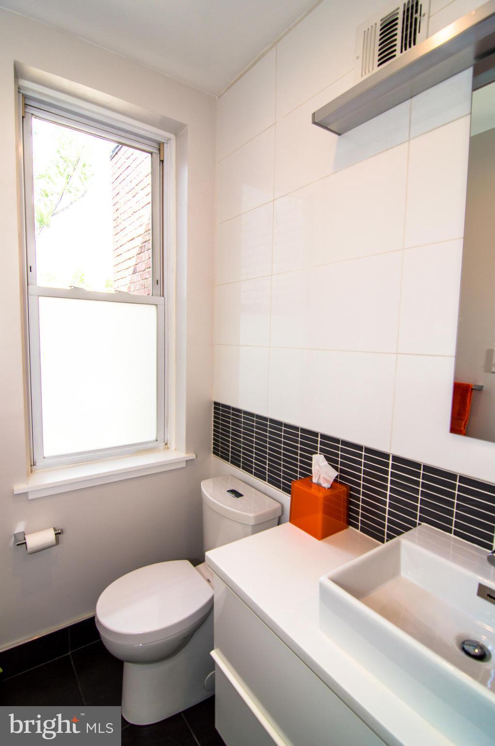 606 14th Place Northeast Washington, DC 20002 - Photo 25 of 28 a bathroom with a sink toilet and shower