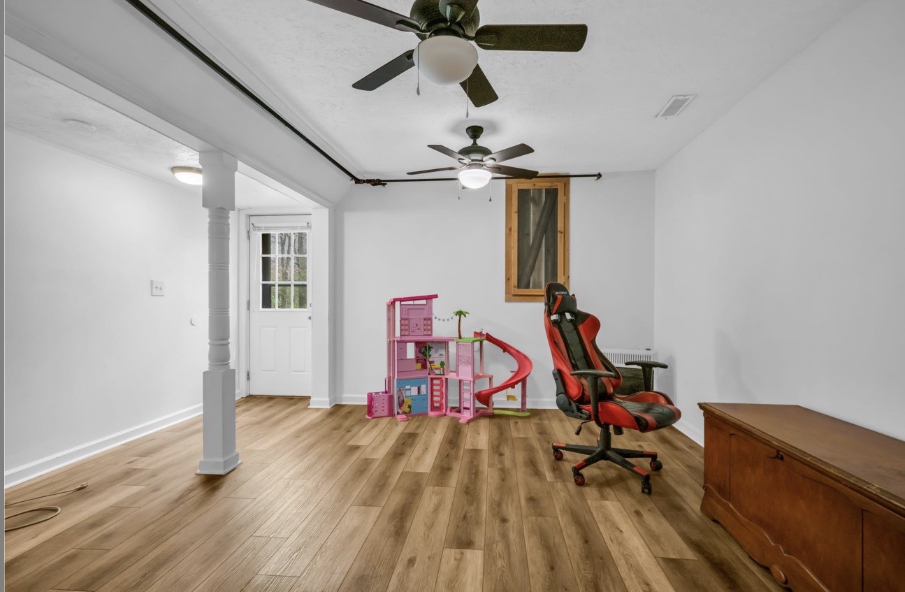 1051 Twin Pine Road Dickson, TN 37055 - Photo 14 of 29 a view of a room with wooden floor ceiling fan