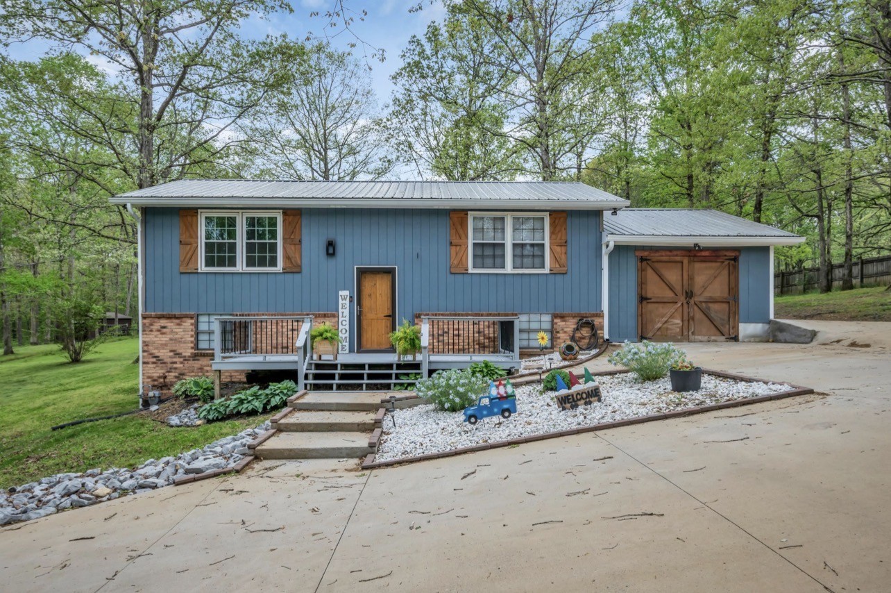 1051 Twin Pine Road Dickson, TN 37055 - Photo 2 of 29 a front view of a house with garden