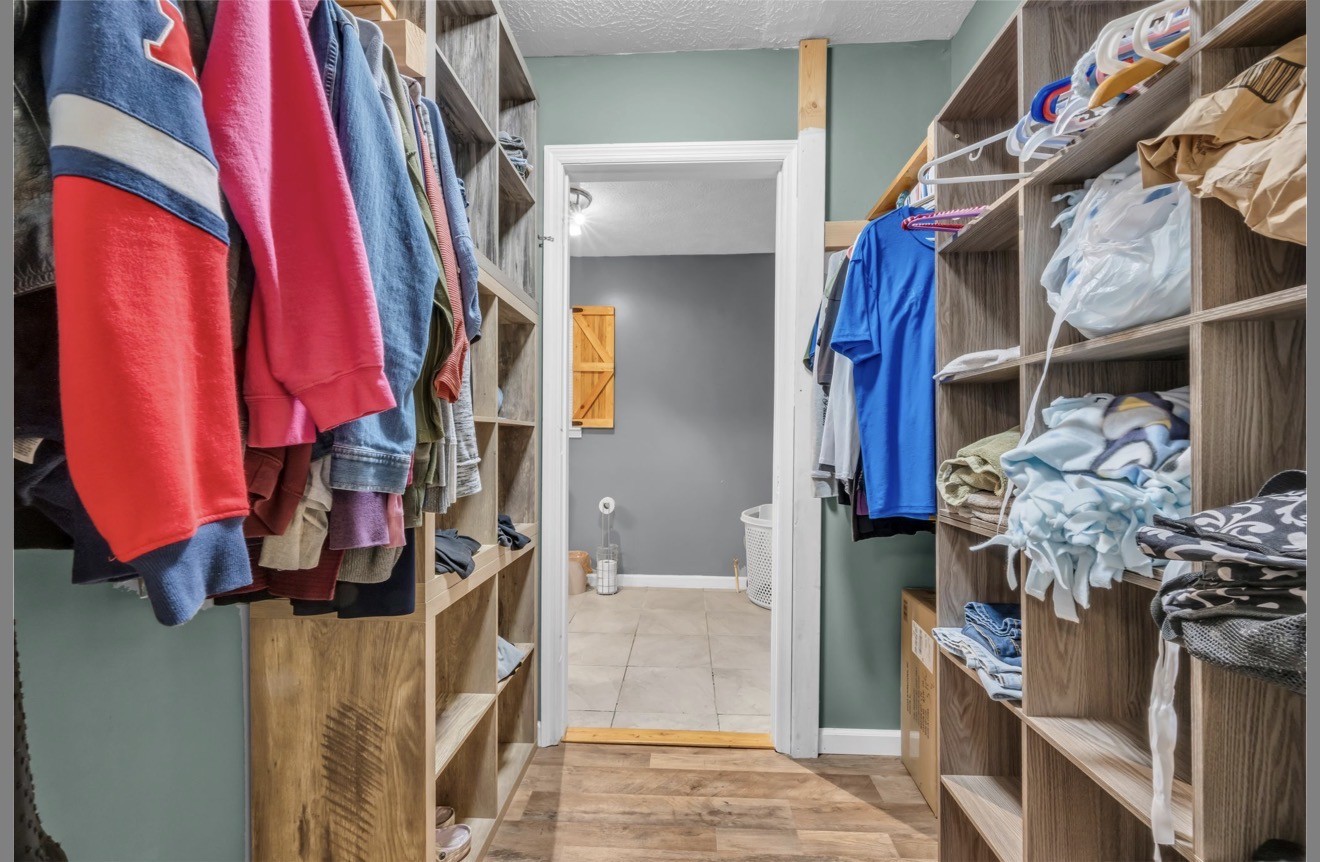 1051 Twin Pine Road Dickson, TN 37055 - Photo 23 of 29 a view of walk in closet with clothes and shoes