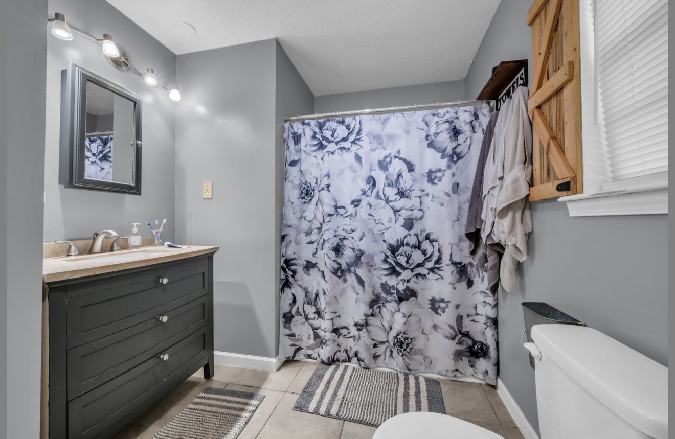 1051 Twin Pine Road Dickson, TN 37055 - Photo 24 of 29 a bathroom with a sink toilet and shower