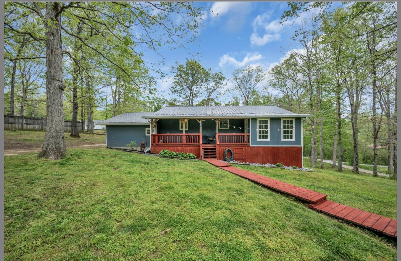 1051 Twin Pine Road Dickson, TN 37055 - Photo 27 of 29 a view of house with a big yard and large trees