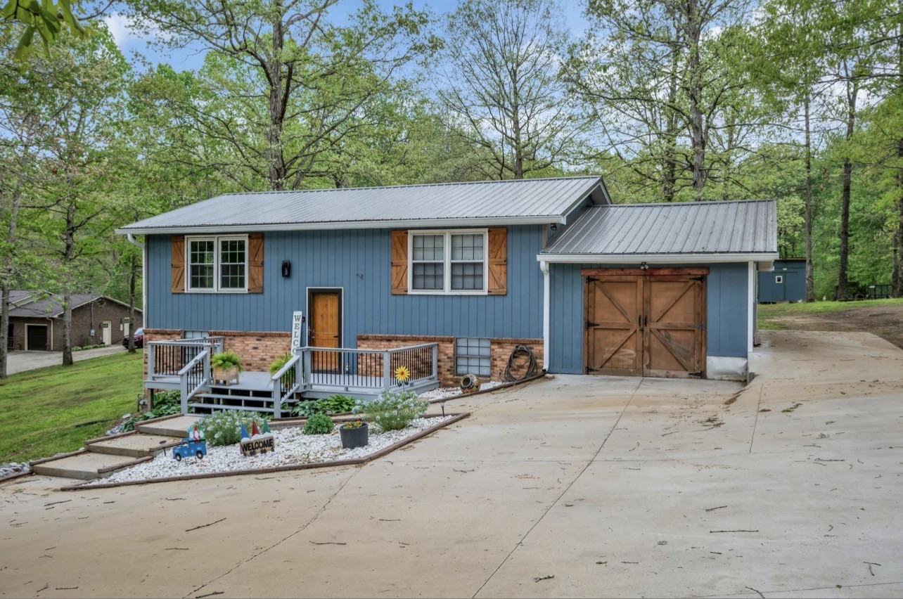 1051 Twin Pine Road Dickson, TN 37055 - Photo 3 of 29 front view of a house with a yard