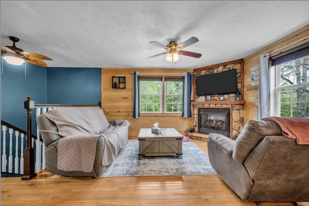 1051 Twin Pine Road Dickson, TN 37055 - Photo 6 of 29 a living room with furniture a fireplace and a flat screen tv