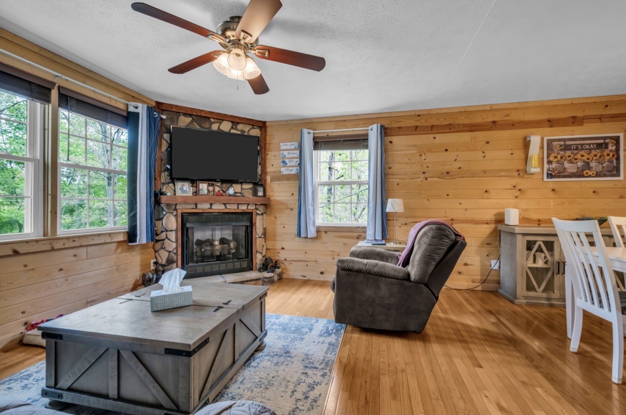 1051 Twin Pine Road Dickson, TN 37055 - Photo 7 of 29 a living room with furniture a fireplace and a large window