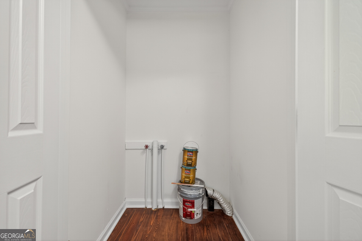 352 3rd Avenue Winder, GA 30680 - Photo 29 of 33 a room with wooden floor and shoes